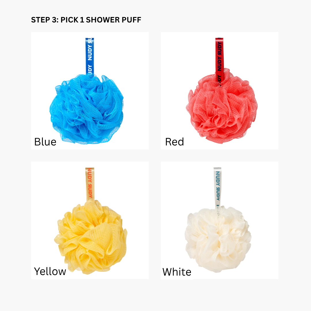 Four Nudy Rudy shower puffs in blue, red, yellow, and white for bath and self-care set