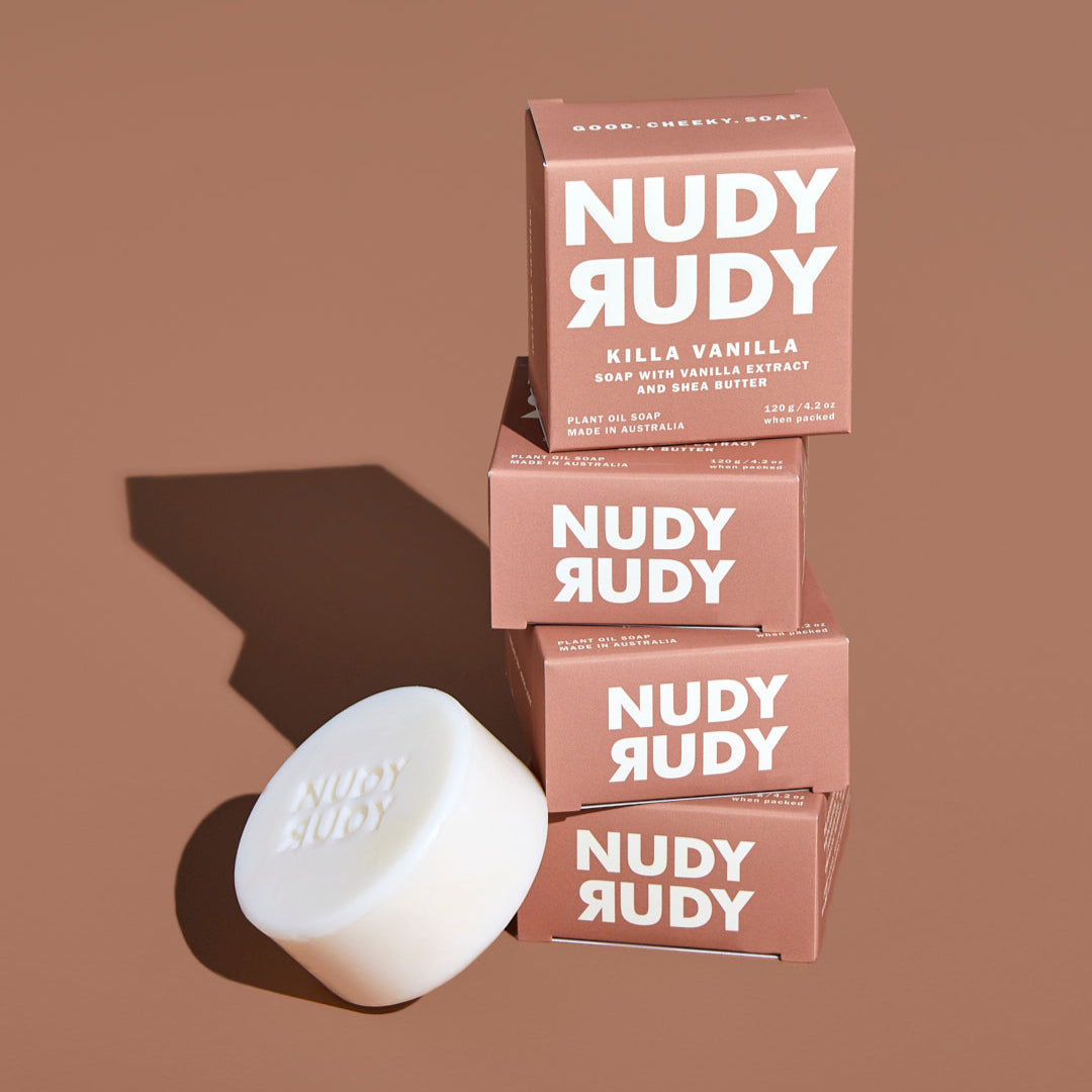 Nudy Rudy soap bars and boxes on a brown background